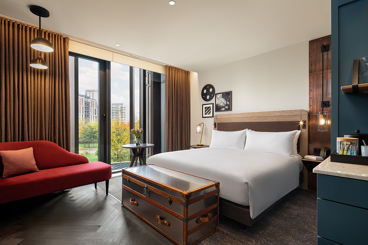 A bedroom in the Gantry Hotel with elegant, high-quality furnishings.