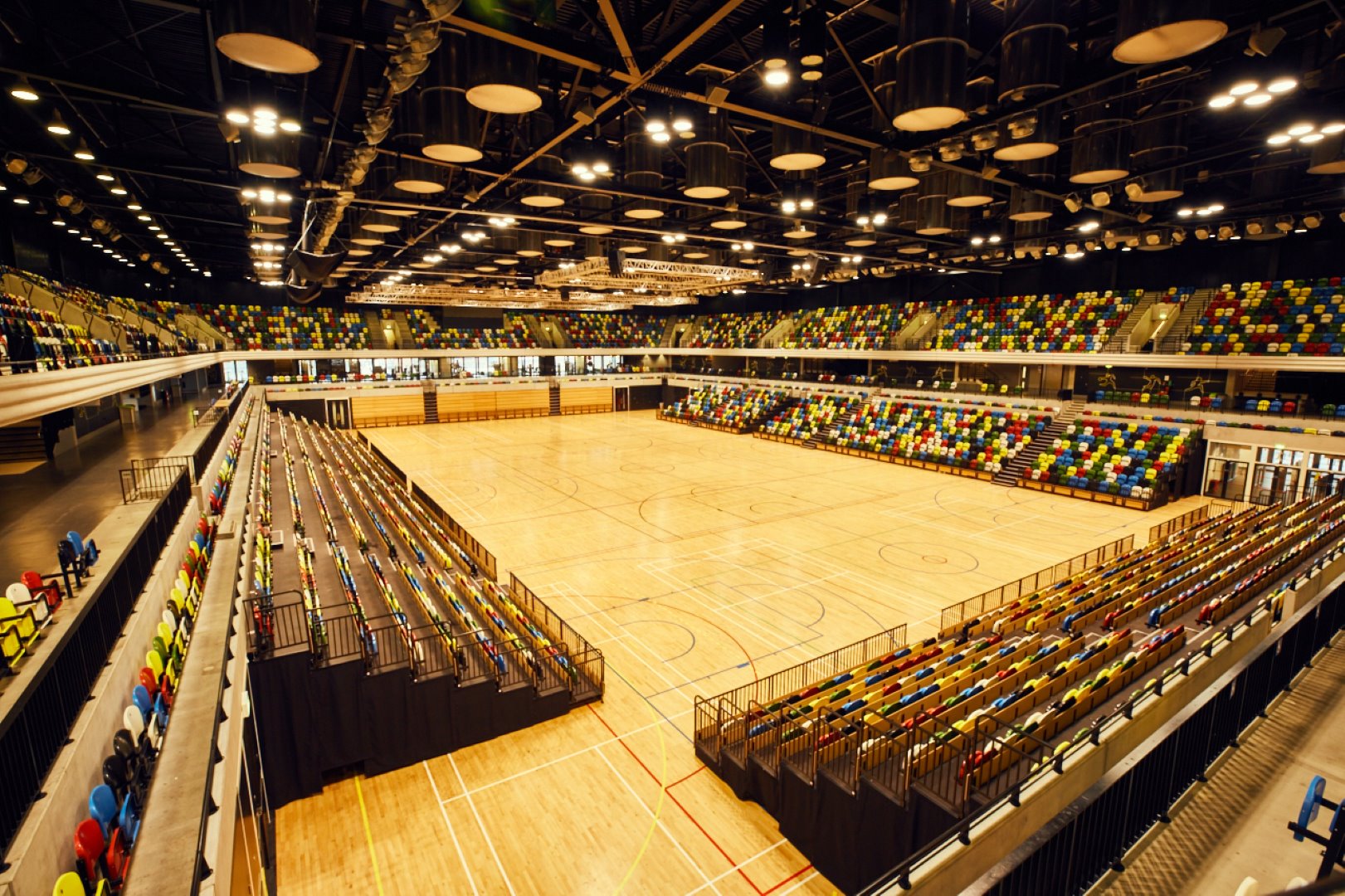 The inside of the venue, the Copperbox Arena, without players. The spectator stands are empty.